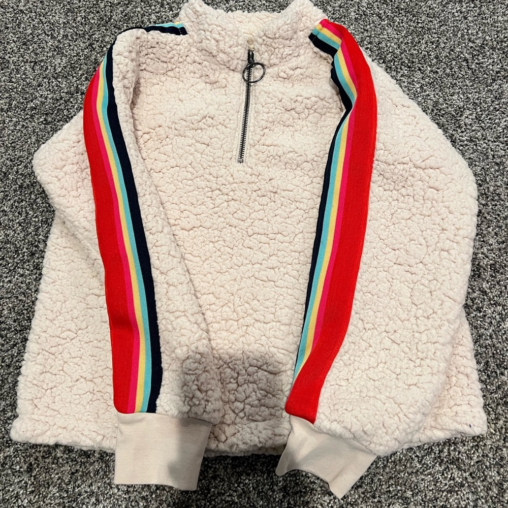 Tucker and rate beige Sherpa with rainbow trim